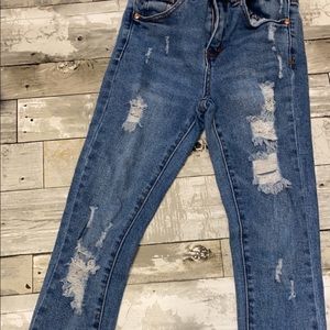 High waisted blue jeans.